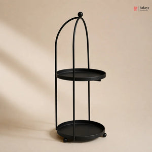 Black metal stand with two round shelves on a beige background
