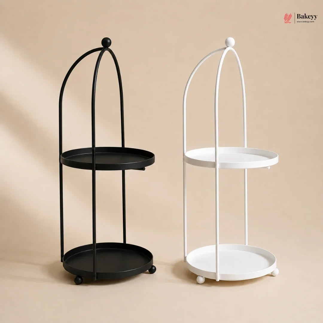 Black and white metal stands with round trays on a beige background