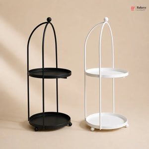 Black and white metal stands with round trays on a beige background
