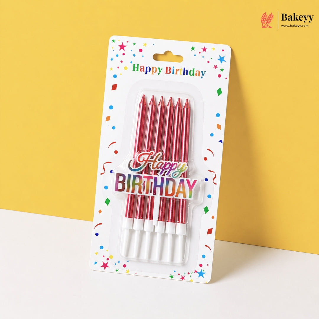 Pack of red birthday candles with 'Happy Birthday' text on a colorful card against a yellow background