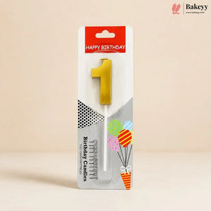 A single yellow number 1 birthday candle in its retail packaging, featuring a red 'HAPPY BIRTHDAY' header and a white card with illustrations of balloons and the text 'Birthday Candles'.