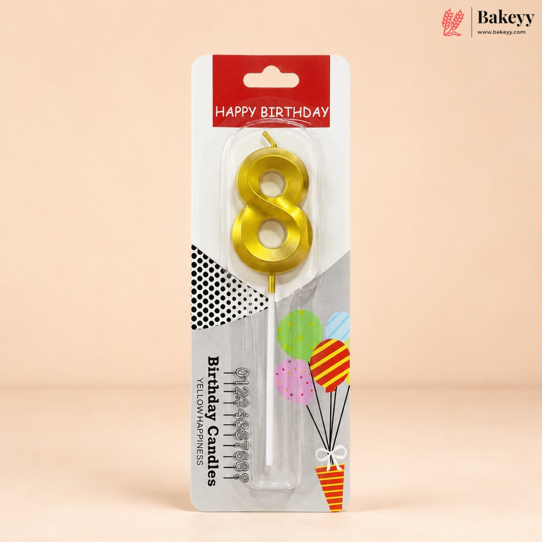 An 8-shaped yellow candle in its retail packaging, featuring a red and white header that reads 'HAPPY BIRTHDAY' and decorative graphics on a beige background.