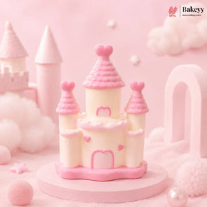 Pink castle-shaped cake on a pink background with 'Bakeyy' branding.