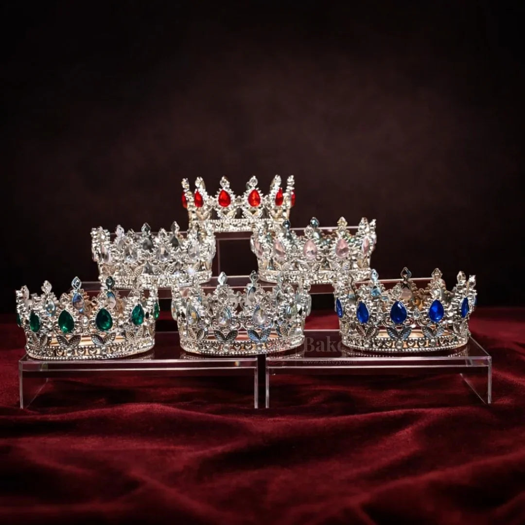 Elegant royal crown design with crystal stones
Premium sliver finish with detailed carving
Lightweight and easy to place on cakes
Reusable decorative topper
Perfect for birthday cakes, themed cakes, baby shoots, and table décor
Available in multiple stone color variants
