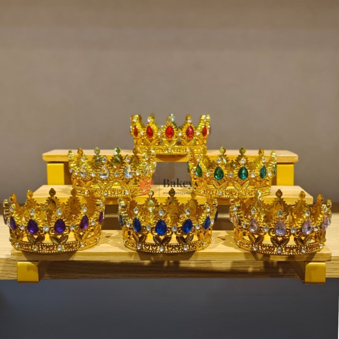 Elegant royal crown design with crystal stones
Premium gold finish with detailed carving
Lightweight and easy to place on cakes
Reusable decorative topper
Perfect for birthday cakes, themed cakes, baby shoots, and table décor
Available in multiple stone color variants