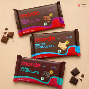 Three Morde chocolate bars in different flavors on a beige background