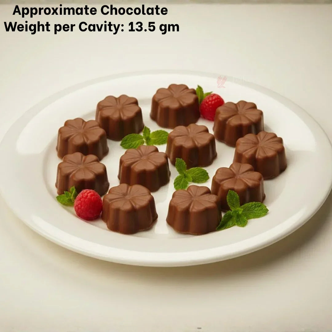 Flower-shaped chocolate bonbons on white plate, garnished with mint and raspberry, Bakeyy baking supplies