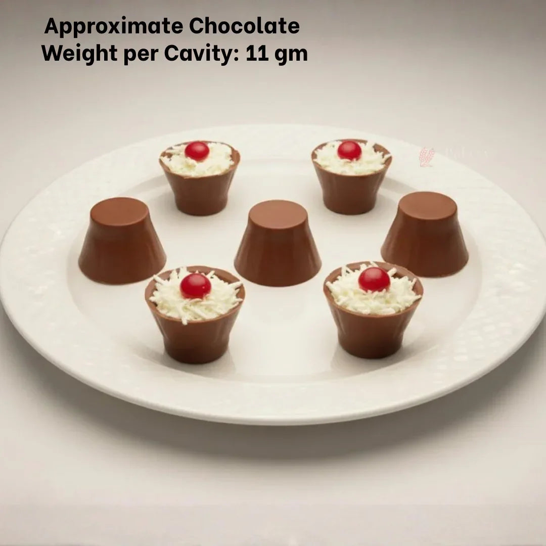 Dome cylinder chocolate mould candies on a white plate, topped with cream and red cherry, Bakeyy baking supplies.