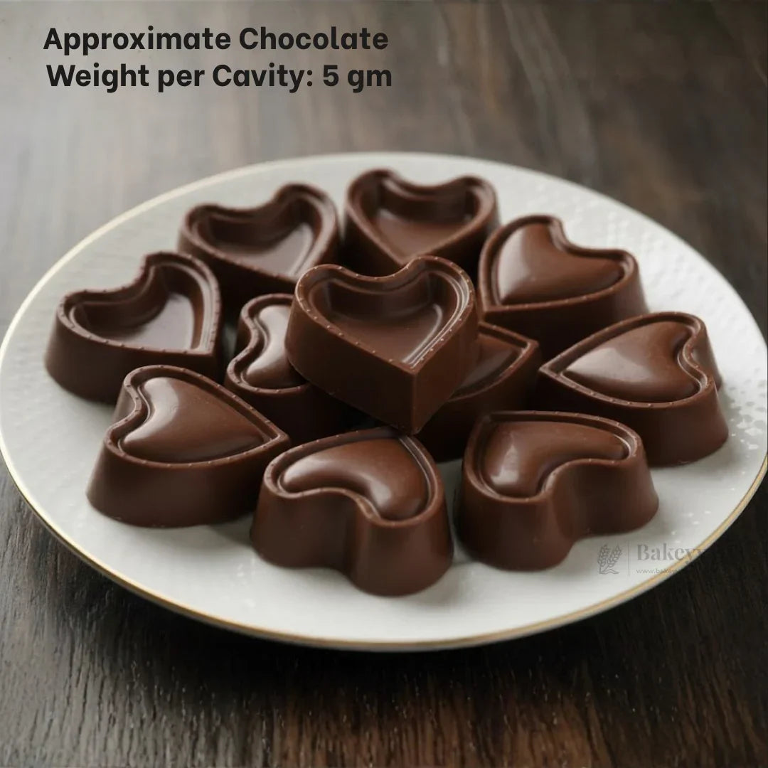 Heart-shaped chocolates arranged on a white plate, perfect for baking gifts from Bakeyy.com