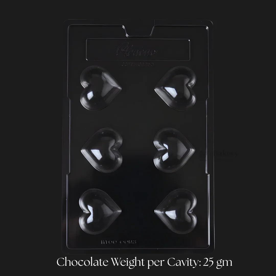 Heart-shaped chocolate mould tray with 6 cavities from Bakeyy.com, ideal for baking supplies.