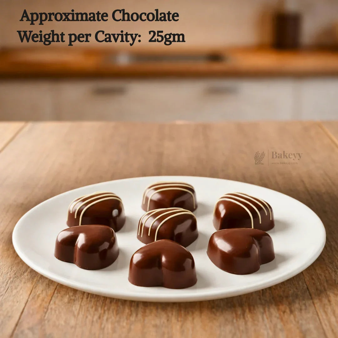 Heart-shaped chocolate moulded candies on a white plate, Bakeyy baking supplies.