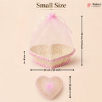 Small size heart-shaped wicker basket with pink mesh cover and measurements on a beige background