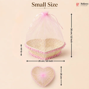 Small size heart-shaped wicker basket with pink mesh cover and measurements on a beige background