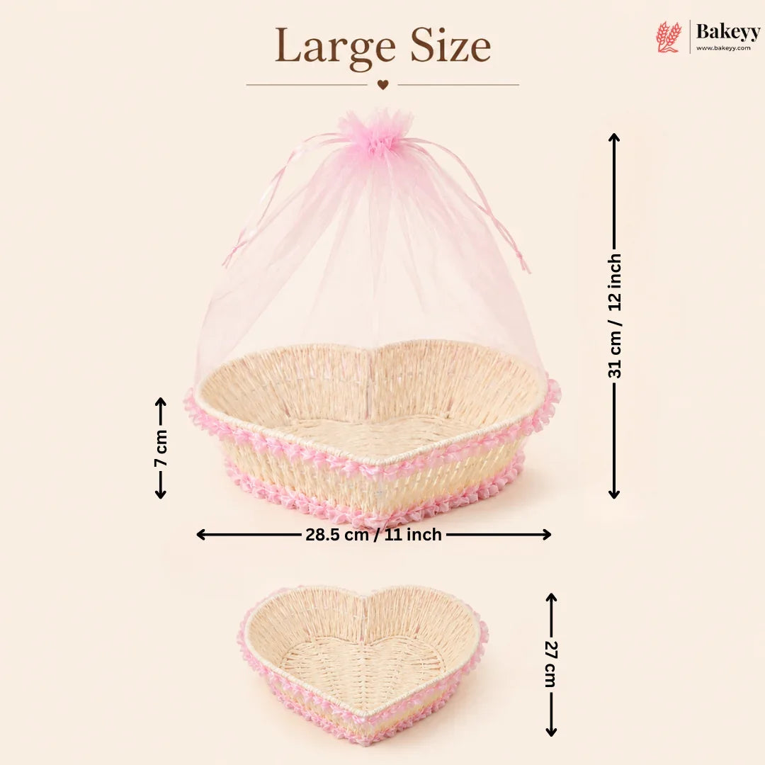 Heart-shaped wicker basket with pink mesh cover and measurements on a beige background