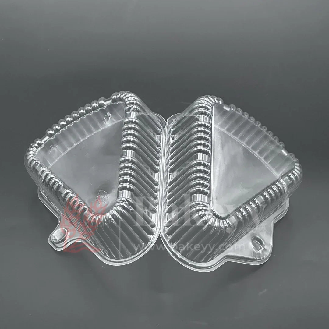 Clear plastic food container with a lid on a dark background