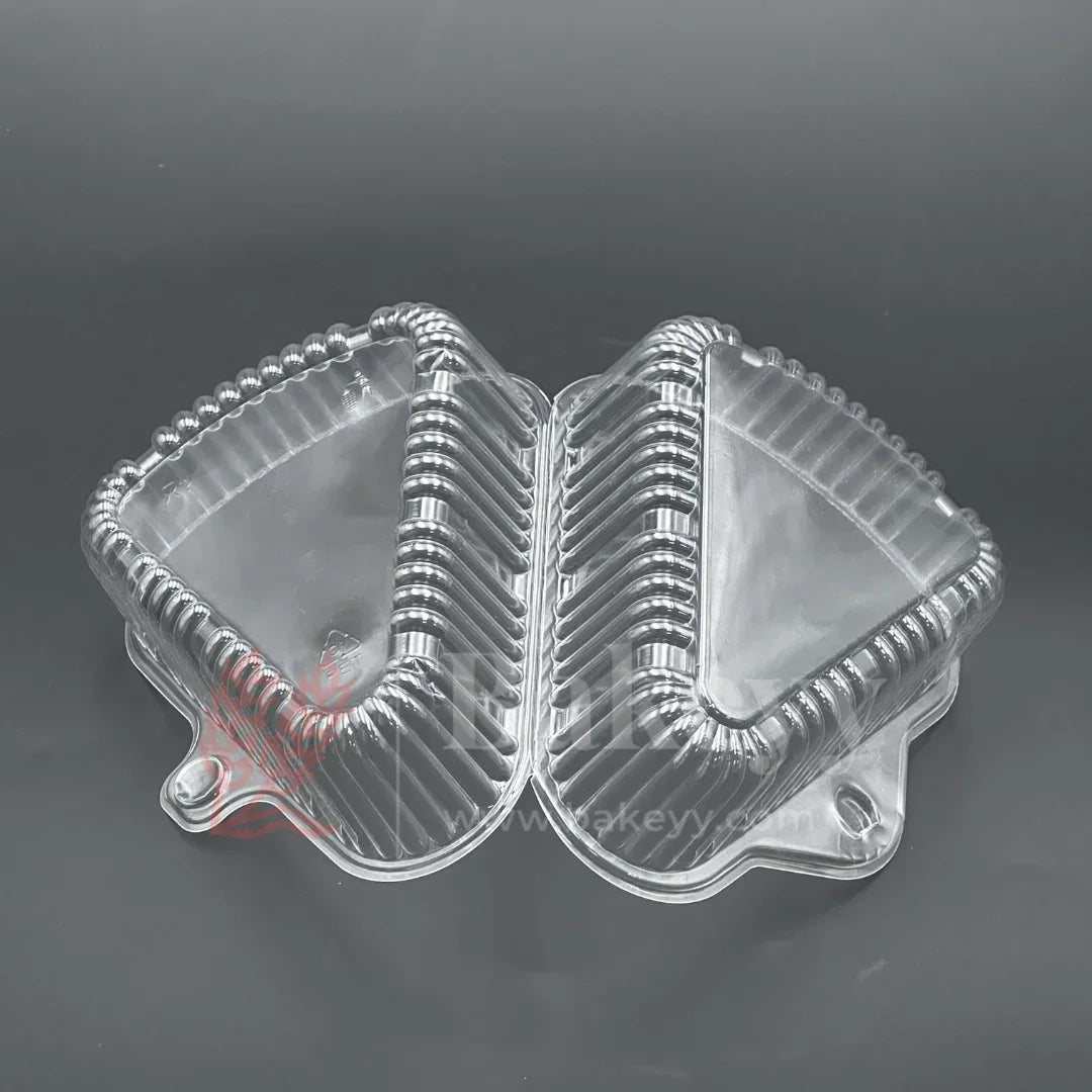 Clear plastic food container with a lid on a dark background