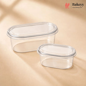 Two clear plastic containers with lids on a beige background, featuring the Bakeyy brand.