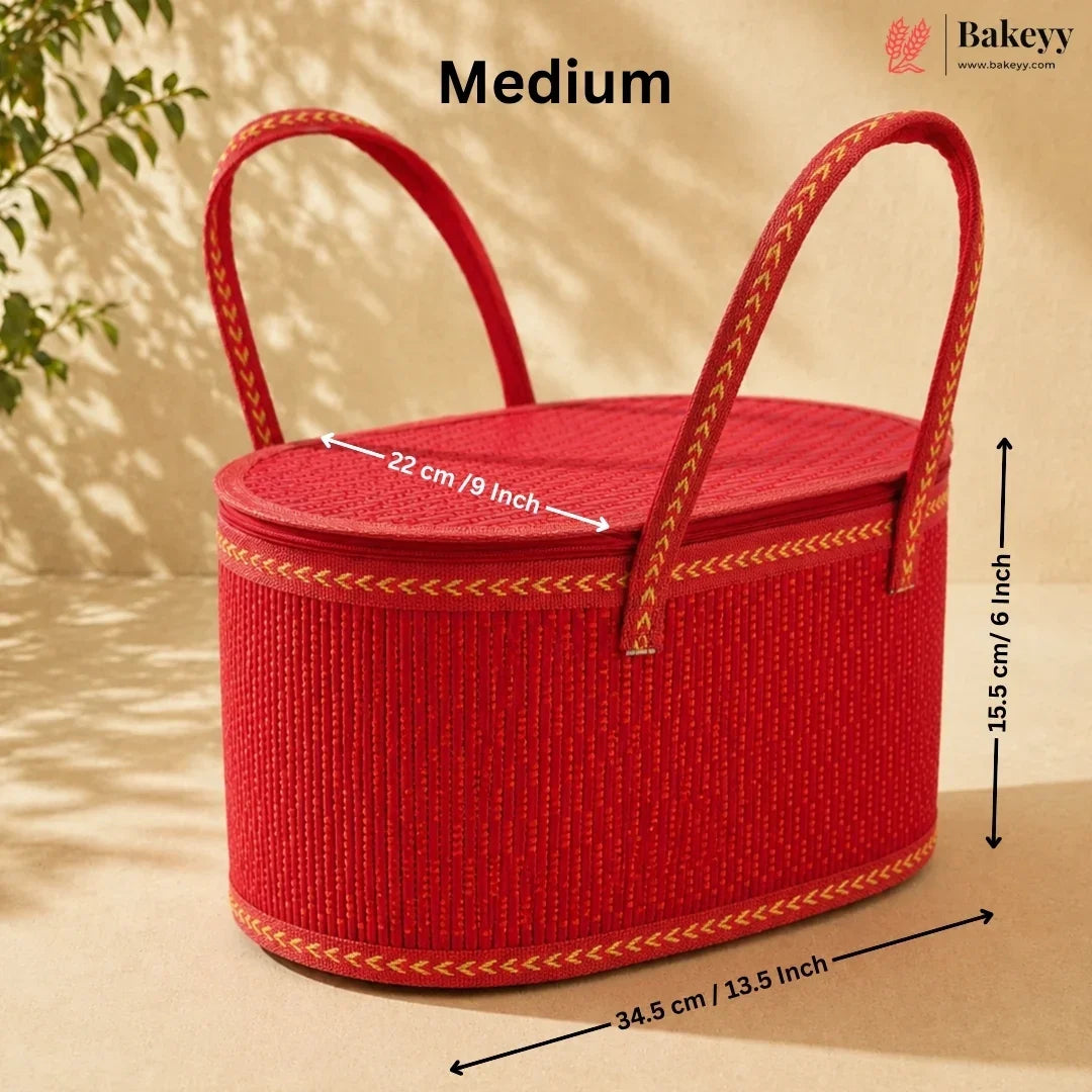 Red woven basket with two top handles, shown with overlaid dimension arrows and text reading Medium, on a beige background with leaf shadows.