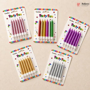 Set of colorful birthday candles in their packaging on a beige background