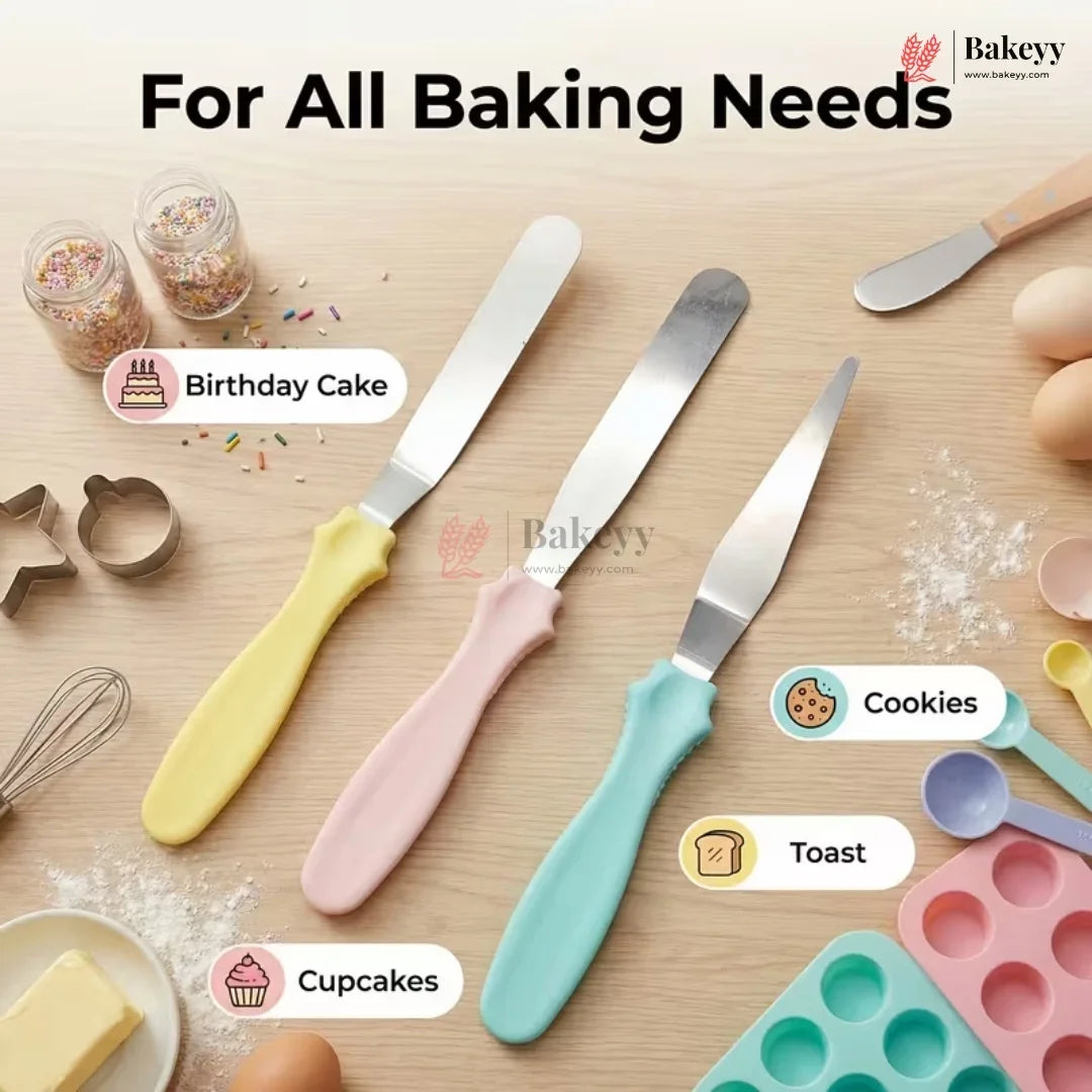 Set of baking tools with colorful handles on a wooden surface, featuring knives and a spatula.