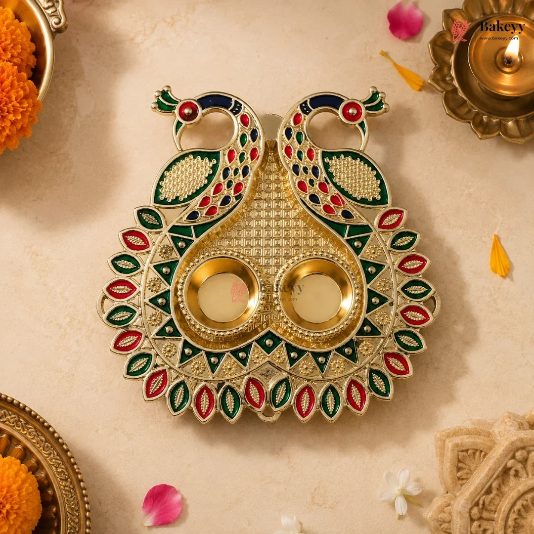 Decorative diya with peacock design on a beige background