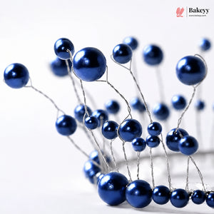 Blue decorative berries on a white background with 'Bakeyy' branding.