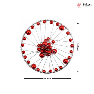 Decorative wheel with red balls and measurements on a white background