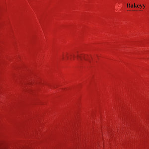 A close-up of bright red sheer mesh fabric with a textured, shimmering finish, swirled in the center. The Bakeyy brand logo is visible in the top right corner.