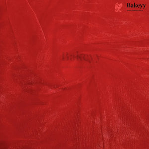 A close-up of bright red sheer mesh fabric with a textured, shimmering finish, swirled in the center. The Bakeyy brand logo is visible in the top right corner.