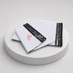 White mailing bag with black strip and red logo on a white platform