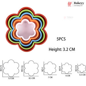 A set of five nested flower-shaped cookie cutters in red, orange, green, blue, and black, with a pink inner tray shown. Text on the image reads '5PCS' and 'Height: 3.