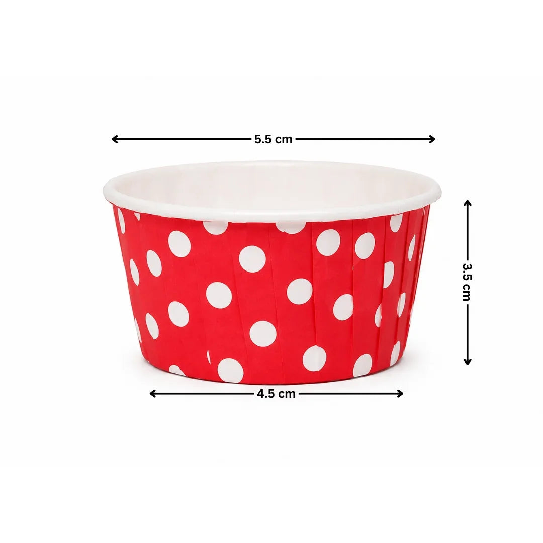 Red paper cup with white polka dots and measurements on a white background
