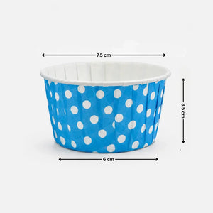 Blue paper cup with white polka dots and measurements on a white background