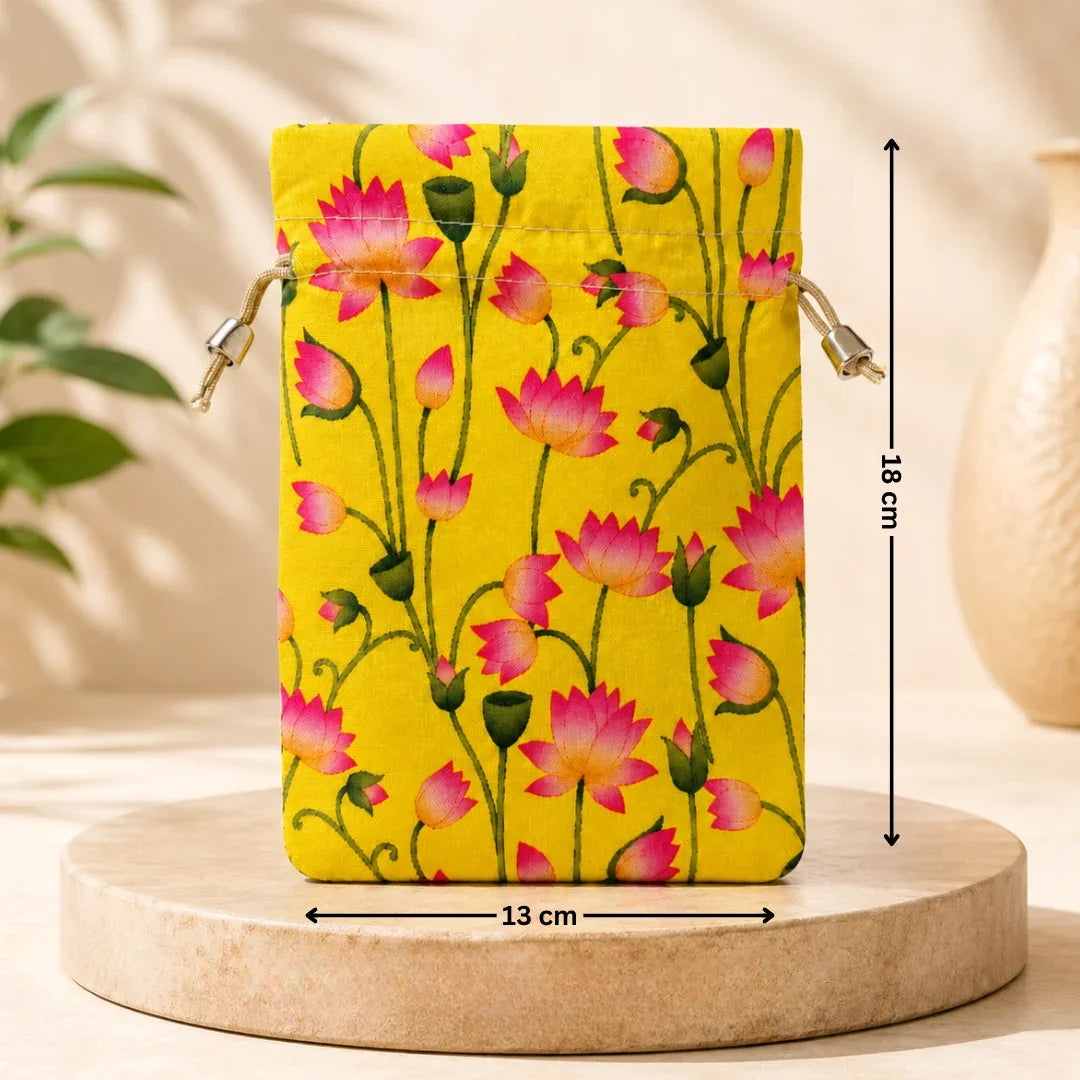Floral-patterned pouch on a wooden stand with measurements, against a neutral background.