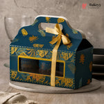 Blue gift box with yellow ribbon and leaf pattern on a neutral background