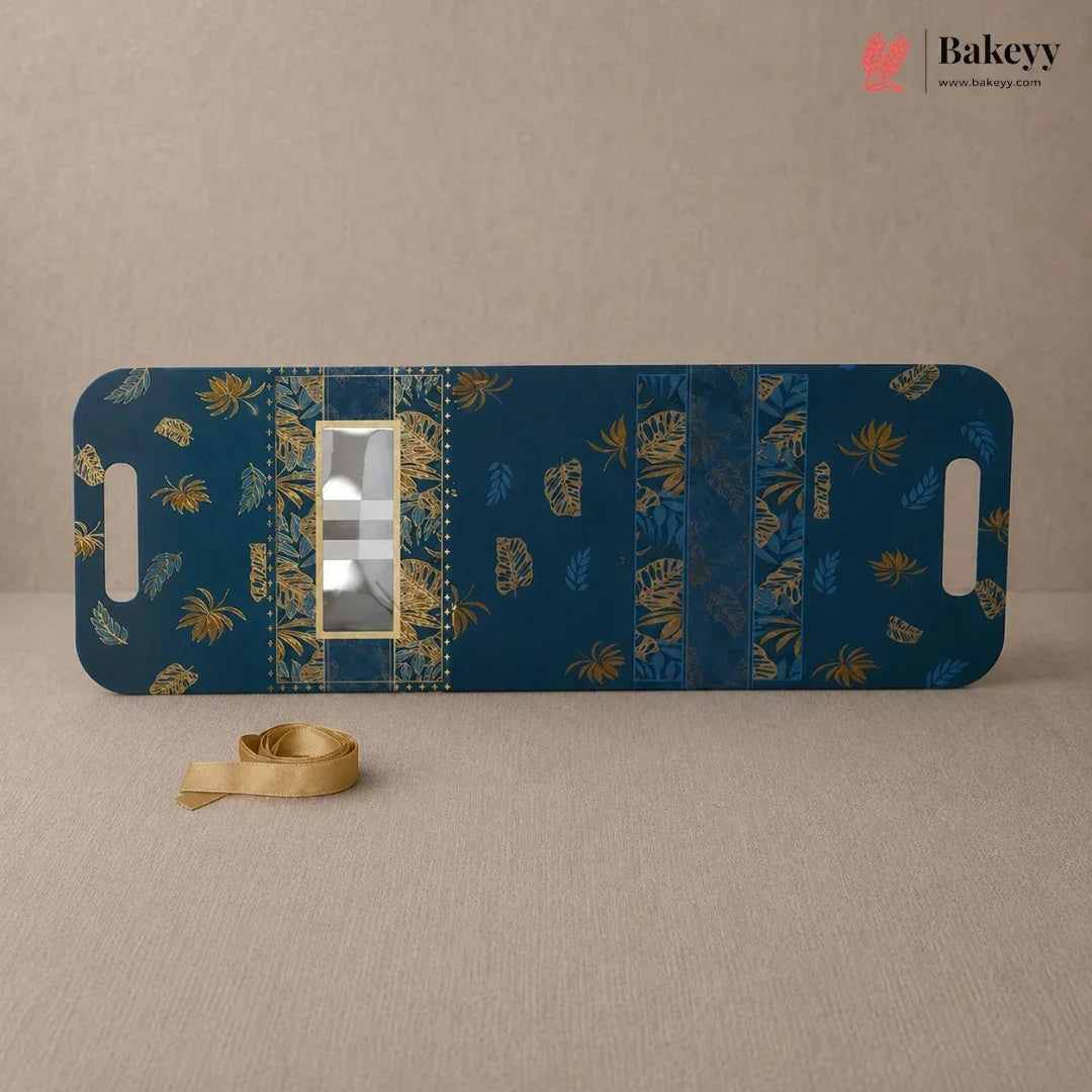 Blue cutting board with gold patterns on a beige background, featuring the Bakeyy brand.