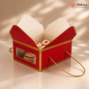 Red and gold gift box with cupcakes on a beige background, featuring the Bakey brand.