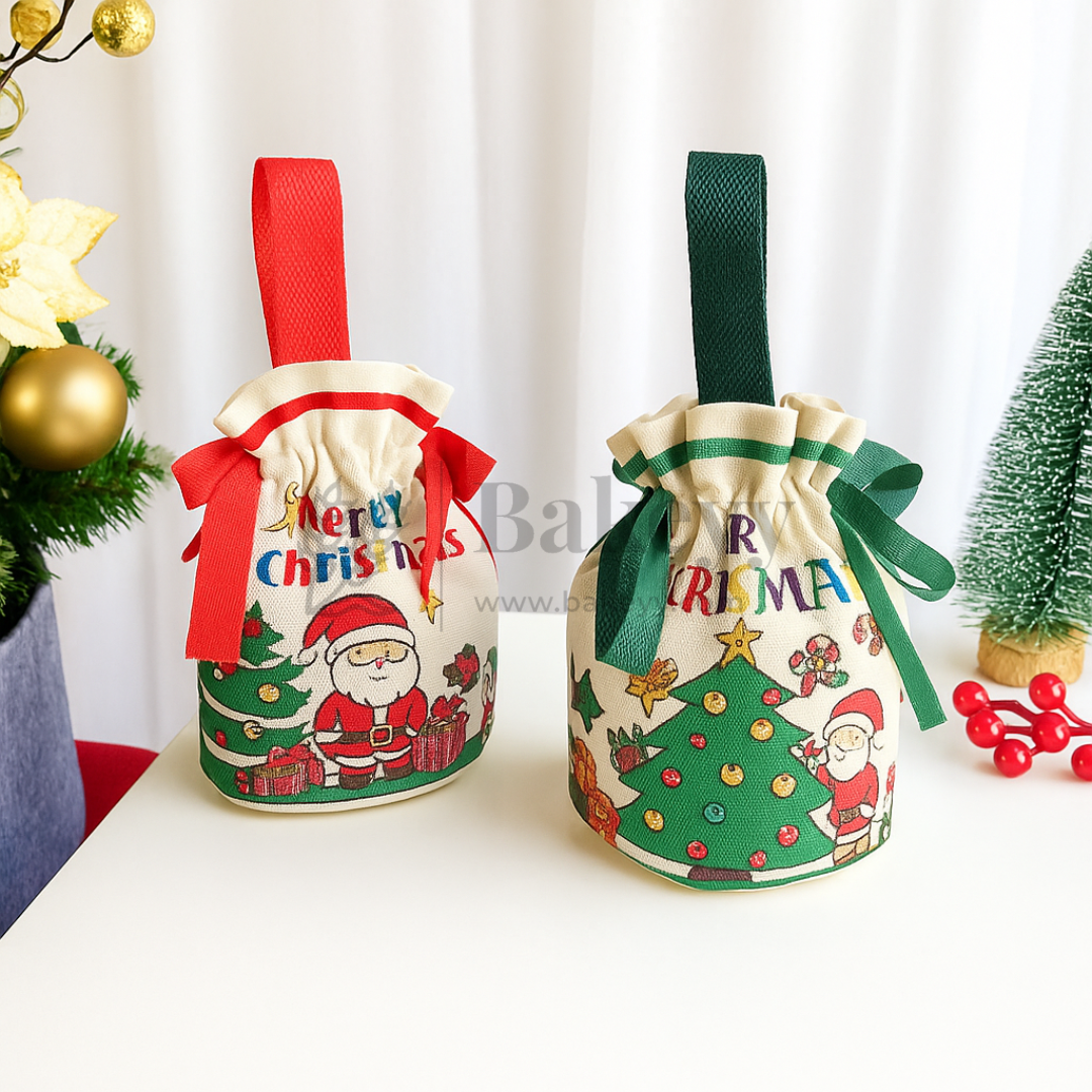 Two Christmas-themed drawstring bags with Santa Claus and trees on a white surface.