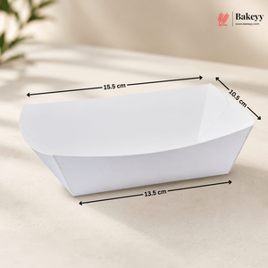 White paper boat with dimensions labeled on a beige background, featuring the Bakeyy brand.