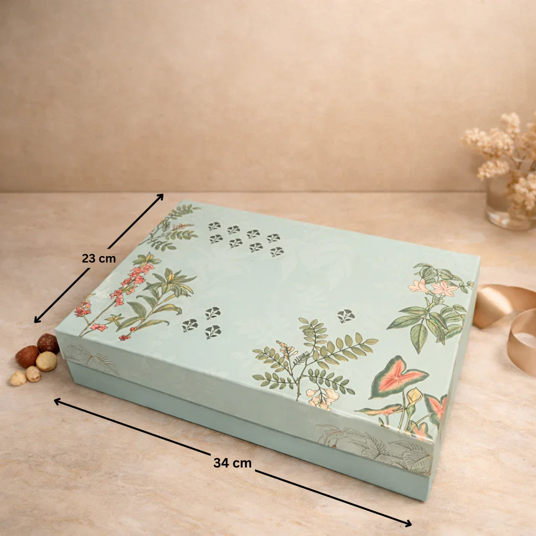 Luxury rigid gift box with botanical floral print
2 printed jars with premium gold lids
9-cavity tray ideal for sweets/chocolates
Ideal for dry fruits, chocolates, mithai, cookies and more
Strong build and premium look for festive gifting