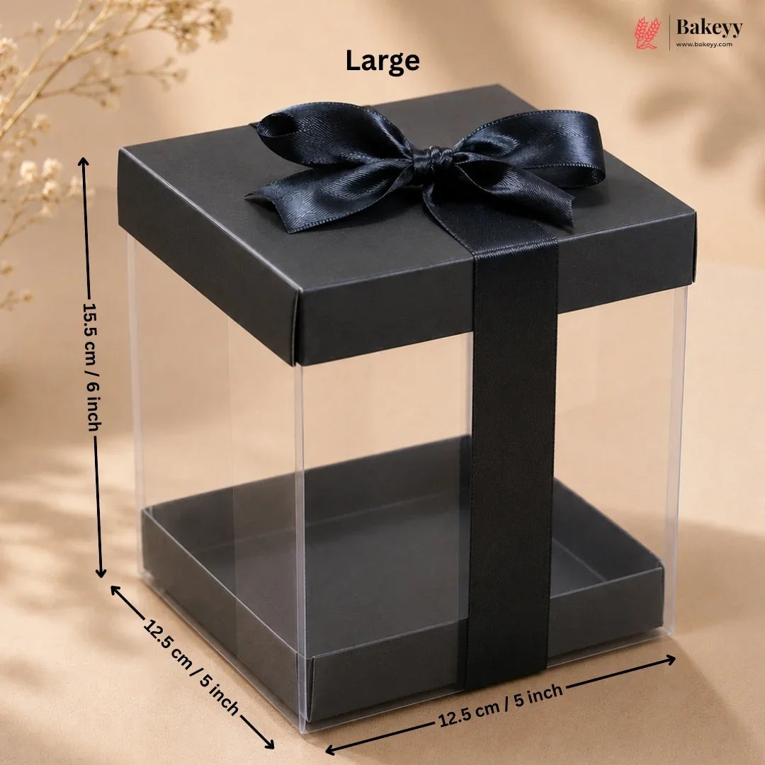 Black gift box with a bow and measurements on a beige background
