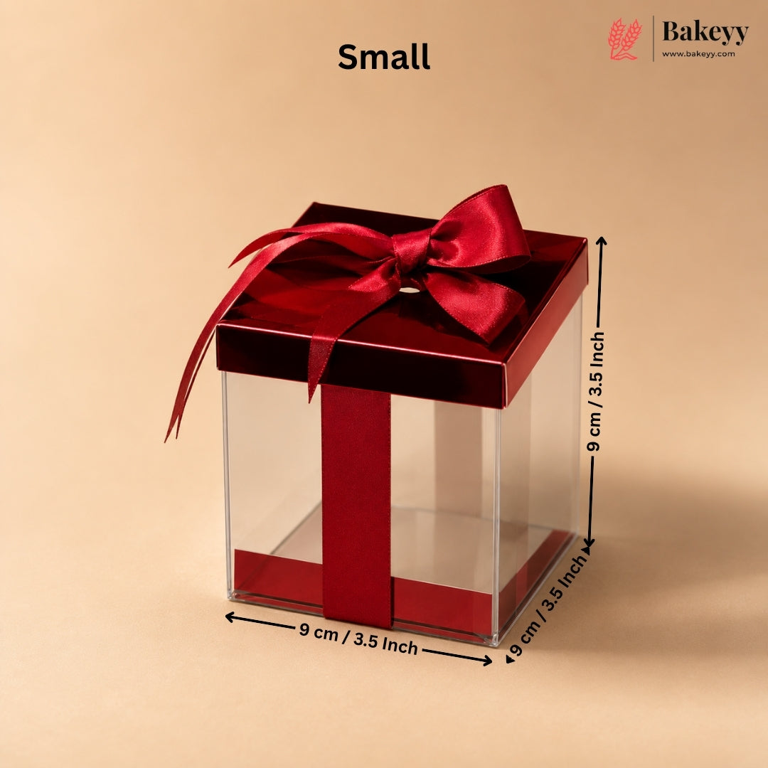 Small gift box with a red ribbon and dimensions on a beige background, featuring the Bakeyy brand.