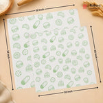 Two white baking sheets with a green pastry pattern, shown with dimension arrows indicating 12 inch by 10 inch sizes on a beige background.