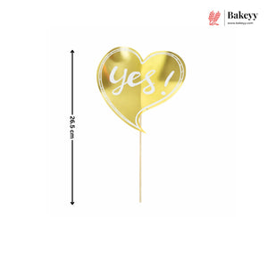 Gold heart-shaped balloon with 'Yes!' text on a white background, featuring Bakeyy branding.