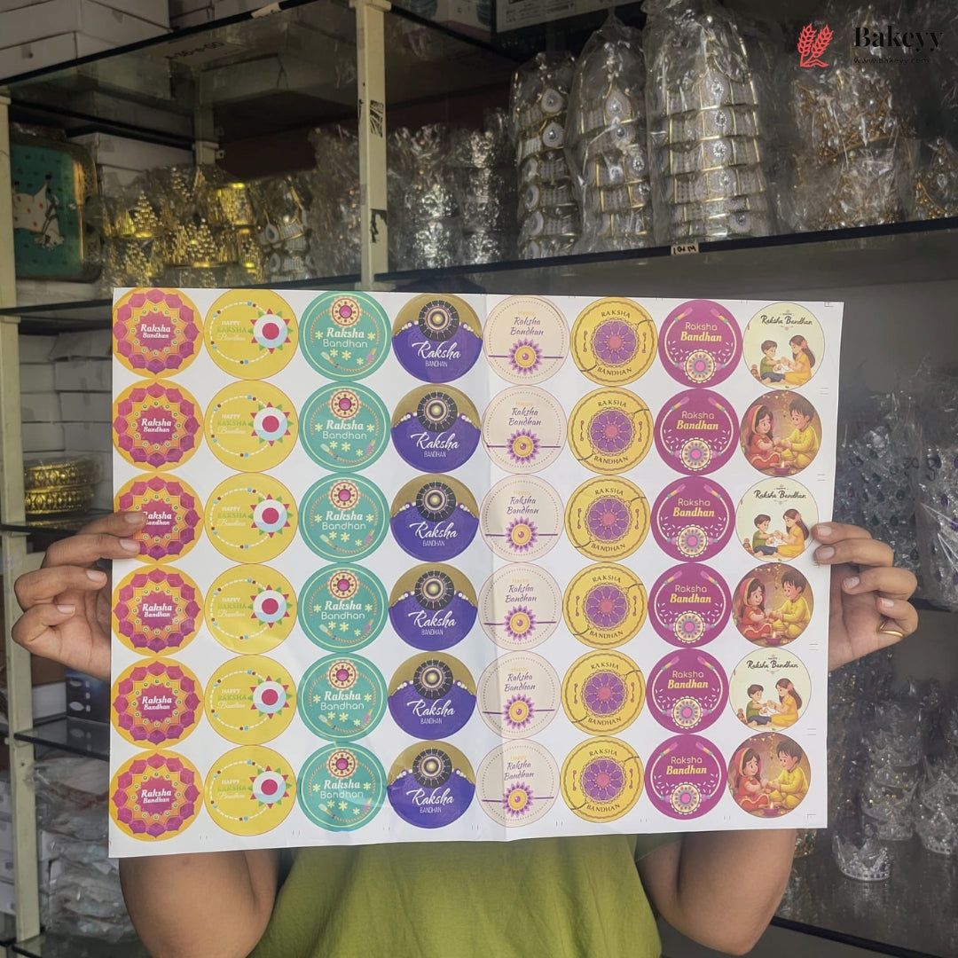 A person holds up a large sheet of round decorative stickers featuring various colorful designs, including floral patterns and illustrations of a traditional Indian deity, in front of a store background.