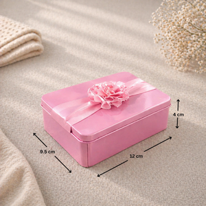 Pink decorative box with a flower on a beige surface with measurements indicated.