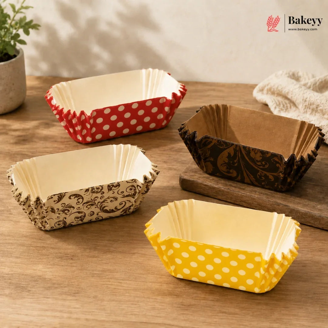 Set of colorful paper baking cups on a wooden surface with 'Bakey' branding.
