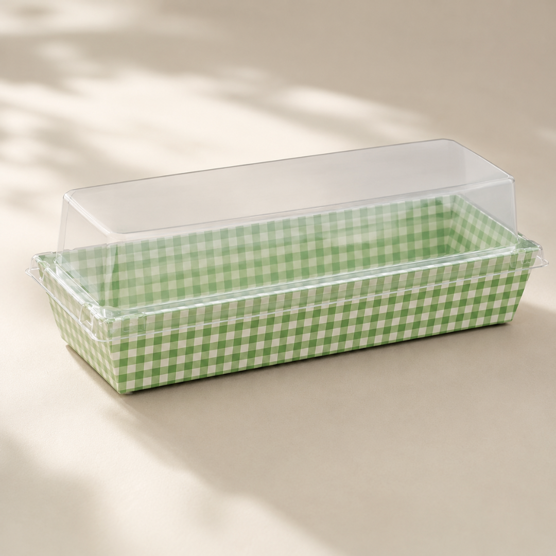 Rectangular baking dish with green checkered pattern on a beige surface