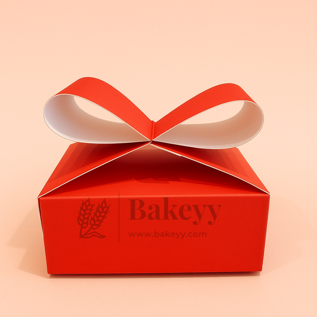 Red gift box with a bow and 'Bakeyy' branding on a beige background