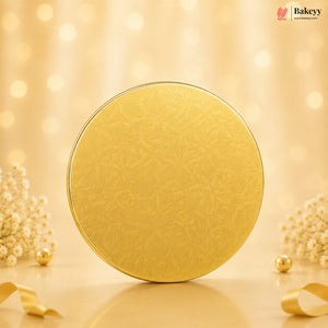 Gold circular object on a beige background with decorative elements